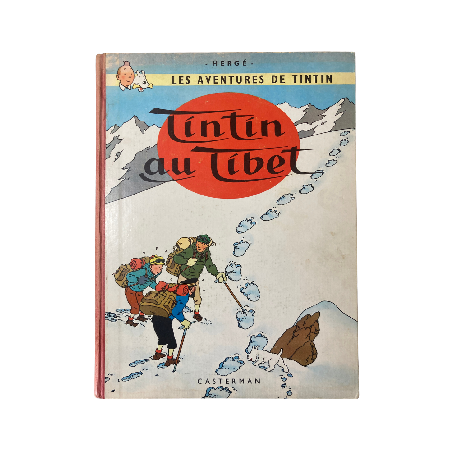 Page du livre "Les Aventures de Tintin : Tintin au Tibet" d'Hergé, illustration colorée montrant Tintin et Milou.