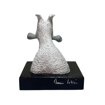 Buste Milou en os, sculpture artistique de la marque Espace714, visible en détail dans l'image.