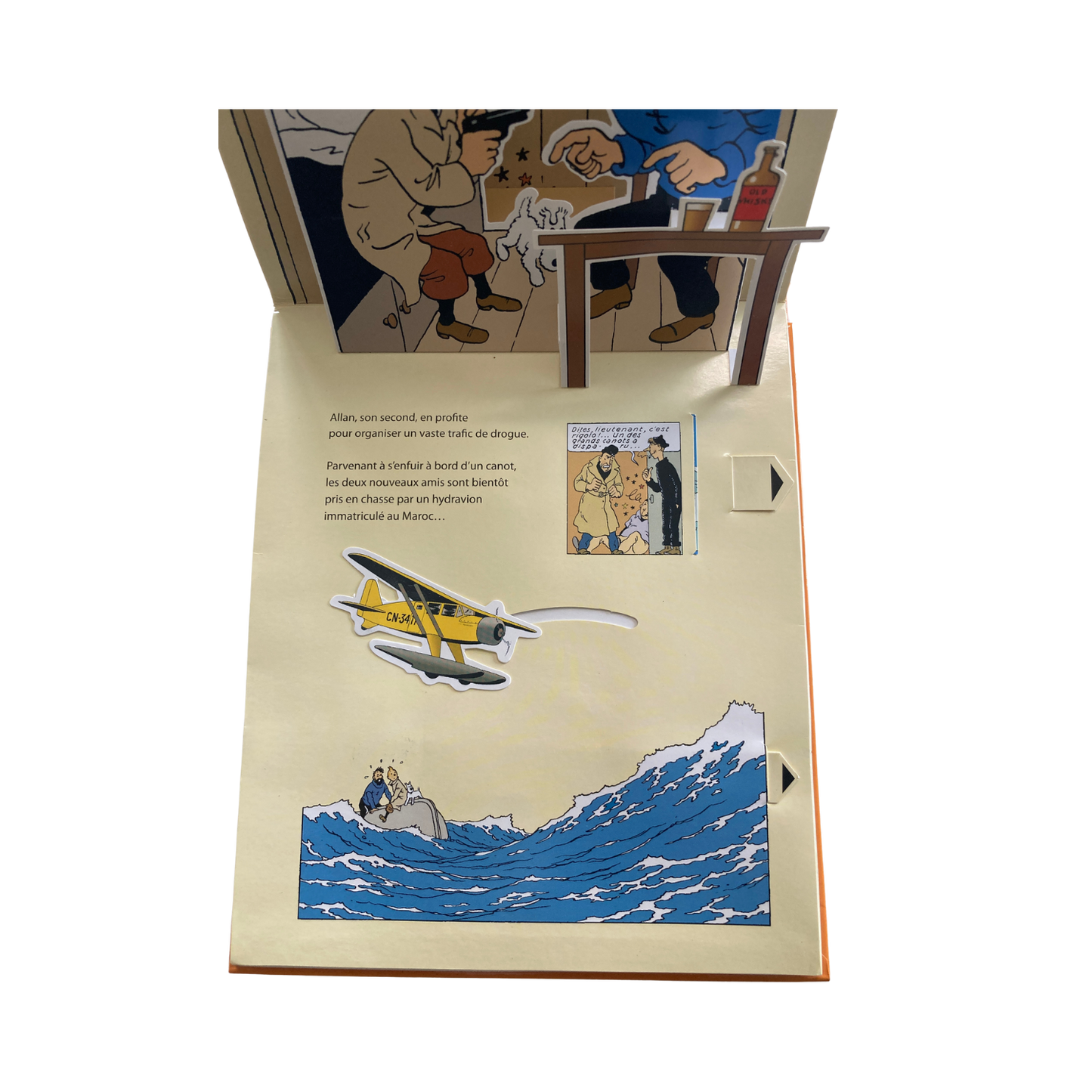 Album Tintin "Le crabe aux pinces d’or" de Hergé, édition pop hop de 2010, illustré avec couverture colorée et détails artistiques.