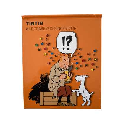 Album de Tintin "Le crabe aux pinces d'or" de Hergé, édition pop hop de 2010, avec couverture colorée et illustrations détaillées.