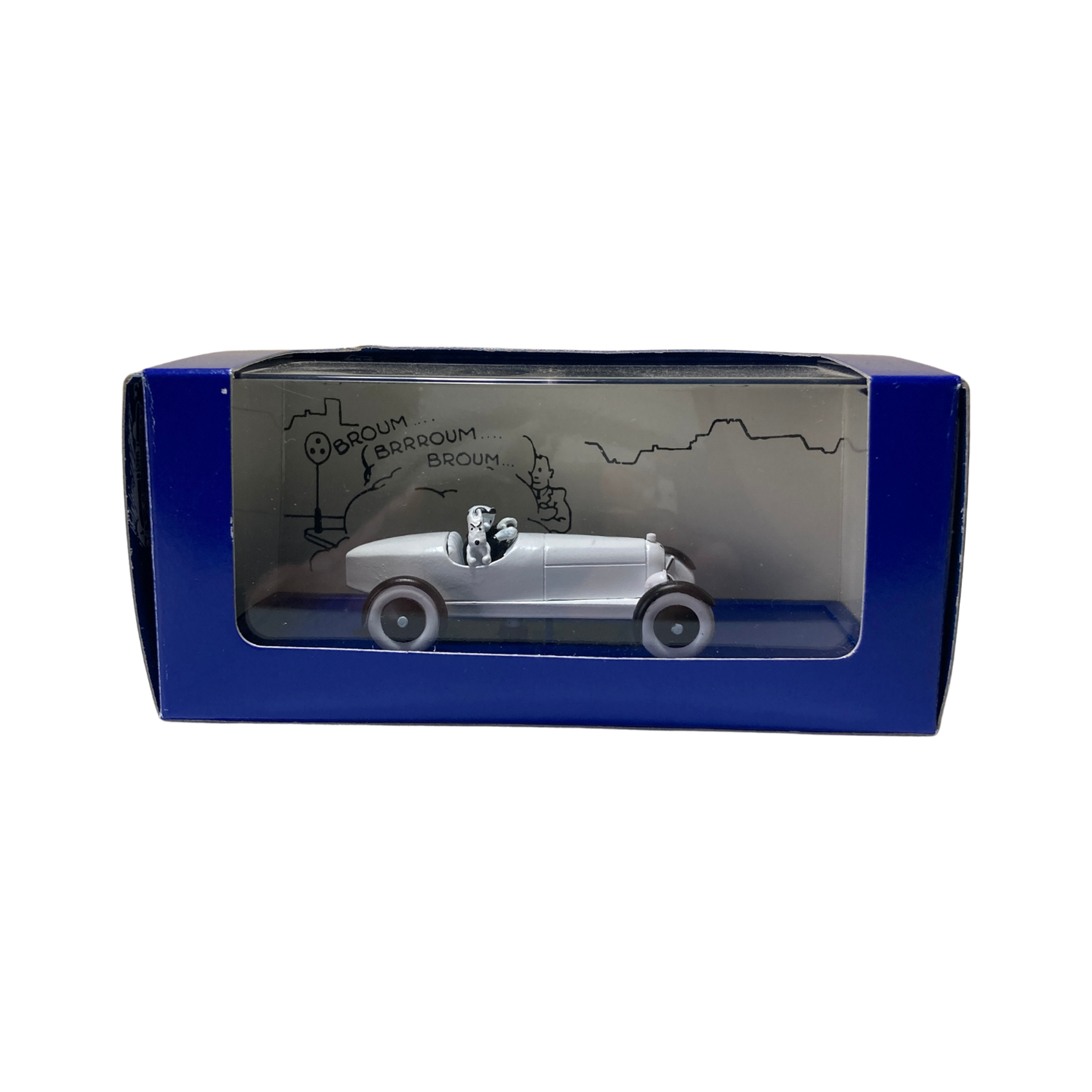 Voiture miniature L’Amilcar Espace714, modèle ancien en métal avec roues noires et détails vintage.