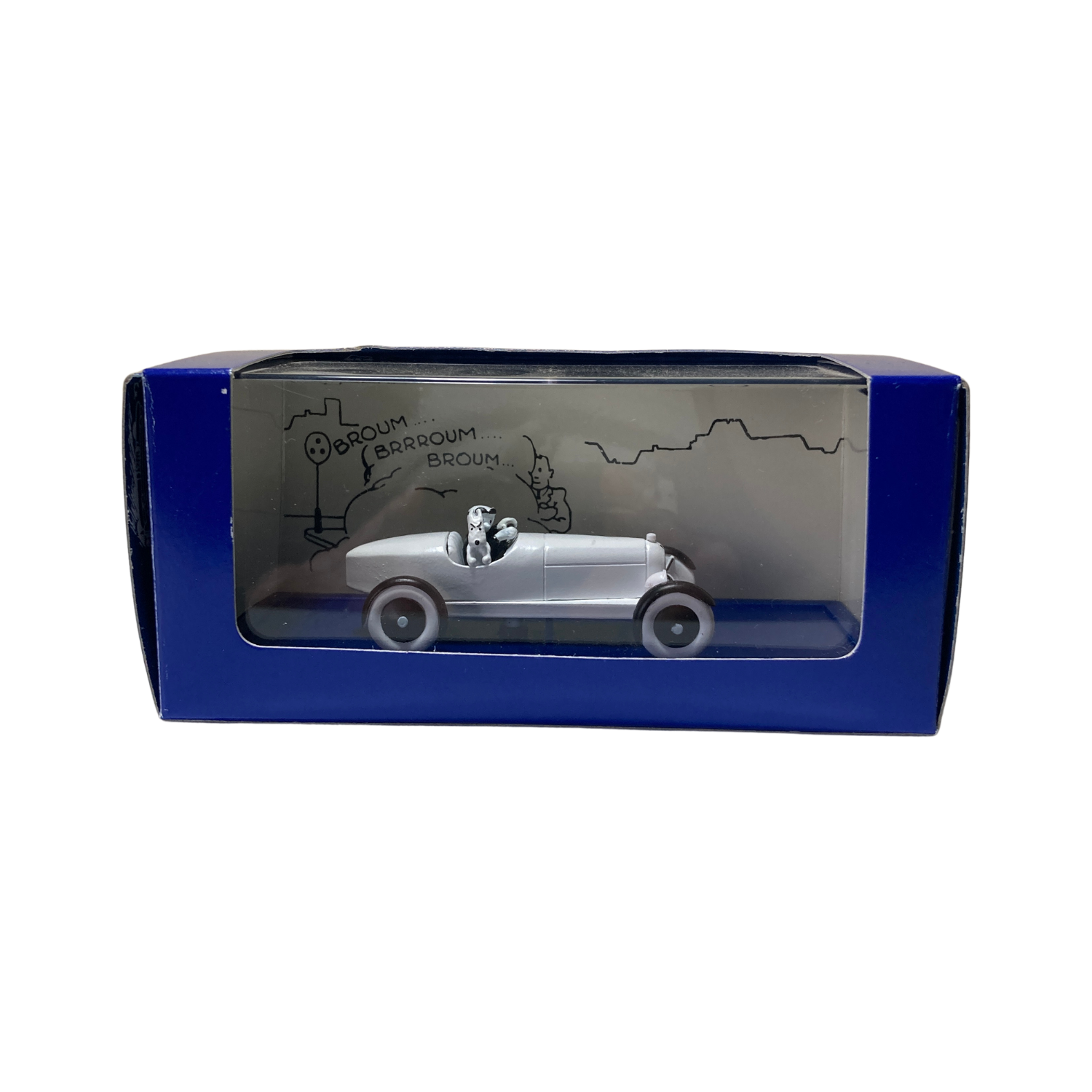 Voiture miniature L’Amilcar Espace714, modèle ancien en métal avec roues noires et détails vintage.