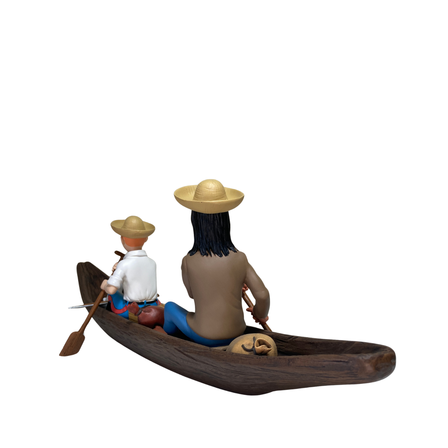 Pirogue en bois de style traditionnel, fabriquée par Espace714, avec détails sculptés et finition polie visible sur l'image.