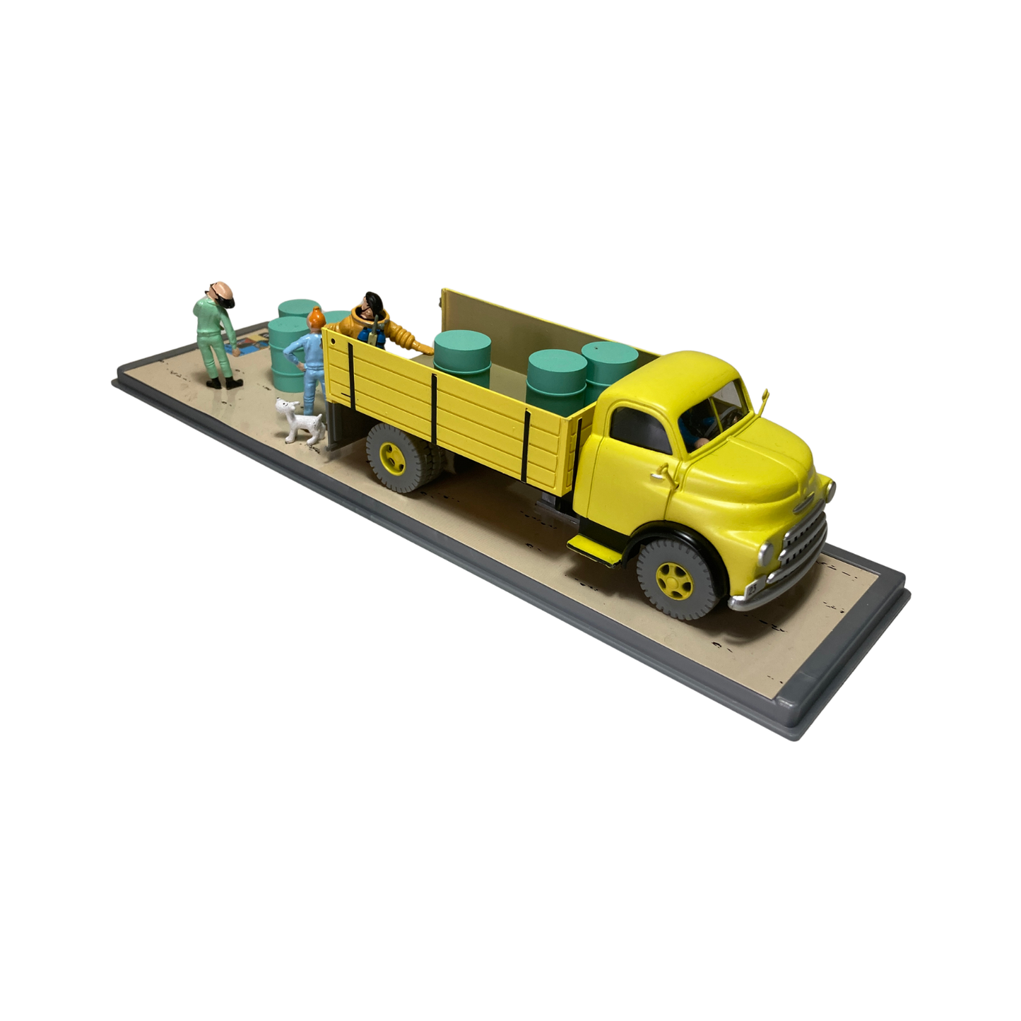 Camion jaune de la base Espace714, vue de côté avec détails colorés et roues visibles, pour enfants ou collection.