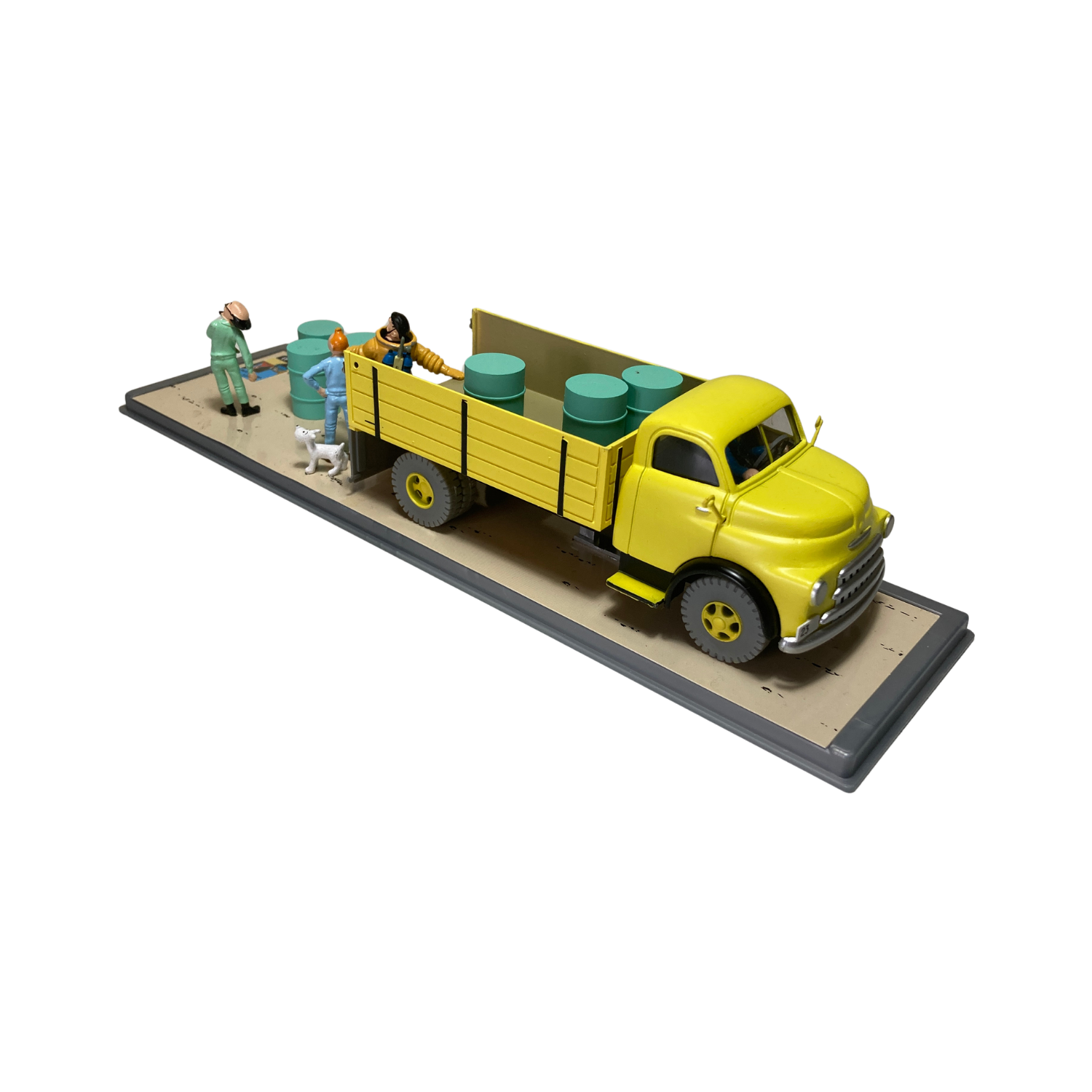 Camion jaune de la base Espace714, vue de côté avec détails colorés et roues visibles, pour enfants ou collection.