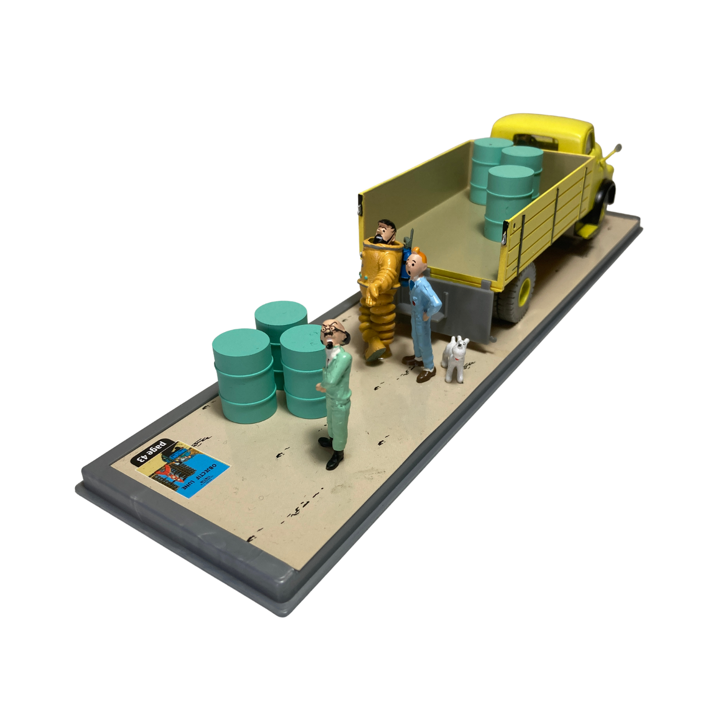 Camion jaune de la base Espace714 avec détails colorés, vue de côté montrant le véhicule enfant en plastique.