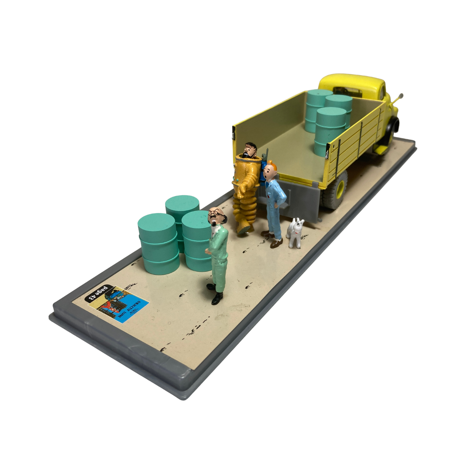 Camion jaune de la base Espace714 avec détails colorés, vue de côté montrant le véhicule enfant en plastique.