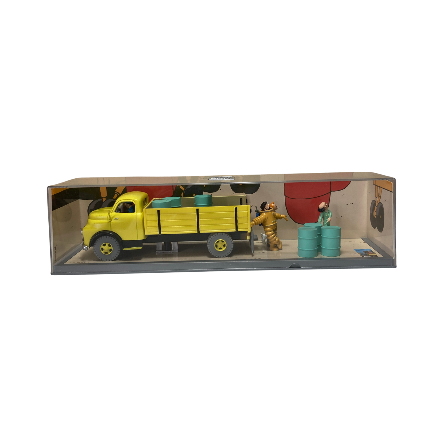 Camion jaune de la base Espace714, vue de côté, avec détails colorés et roues visibles sur fond neutre.