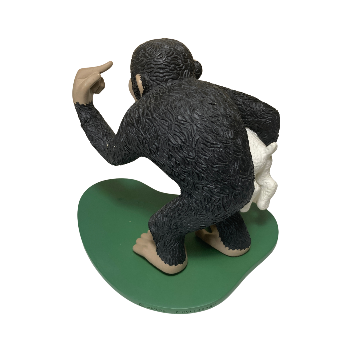 Singe Congo en peluche portant Milou, figurine de collection, avec détails colorés et expression amicale.