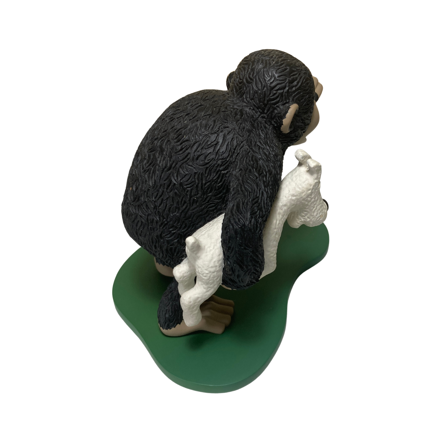 Singe Congo en peluche portant Milou, personnage de bande dessinée, assis avec détails colorés, par Espace714.