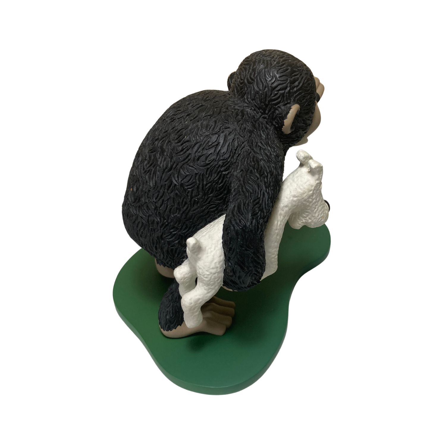 Singe Congo en peluche portant Milou, personnage de bande dessinée, assis avec détails colorés, par Espace714.