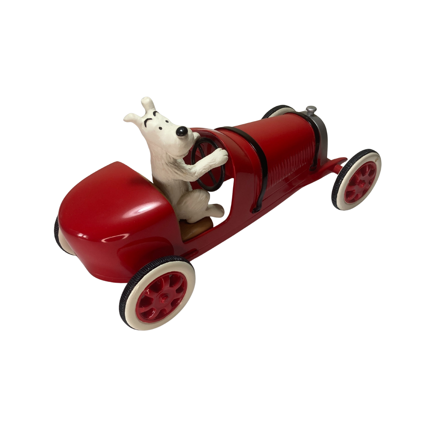 Milou dans la voiture d’Abdallah, personnage de bande dessinée, assis sur le siège conducteur dans une voiture colorée.