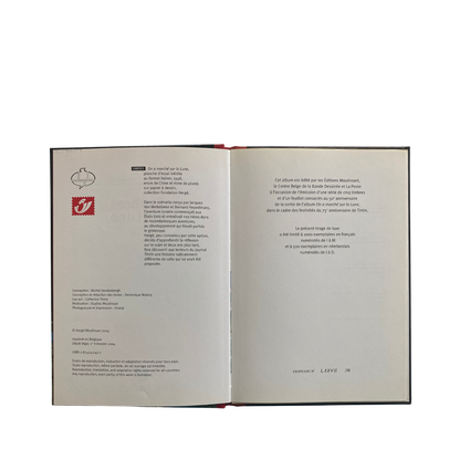 Ouvrage commémoratif pour le 50ème anniversaire de l'album "On a marché sur la Lune" par Espace714, avec couverture illustrée.