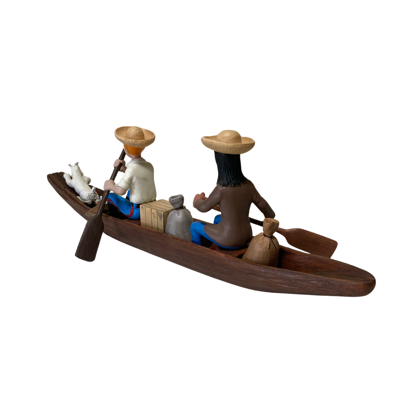 Petite pirogue en bois avec Tintin, l’Indien et Milou, illustrant une scène de bande dessinée.