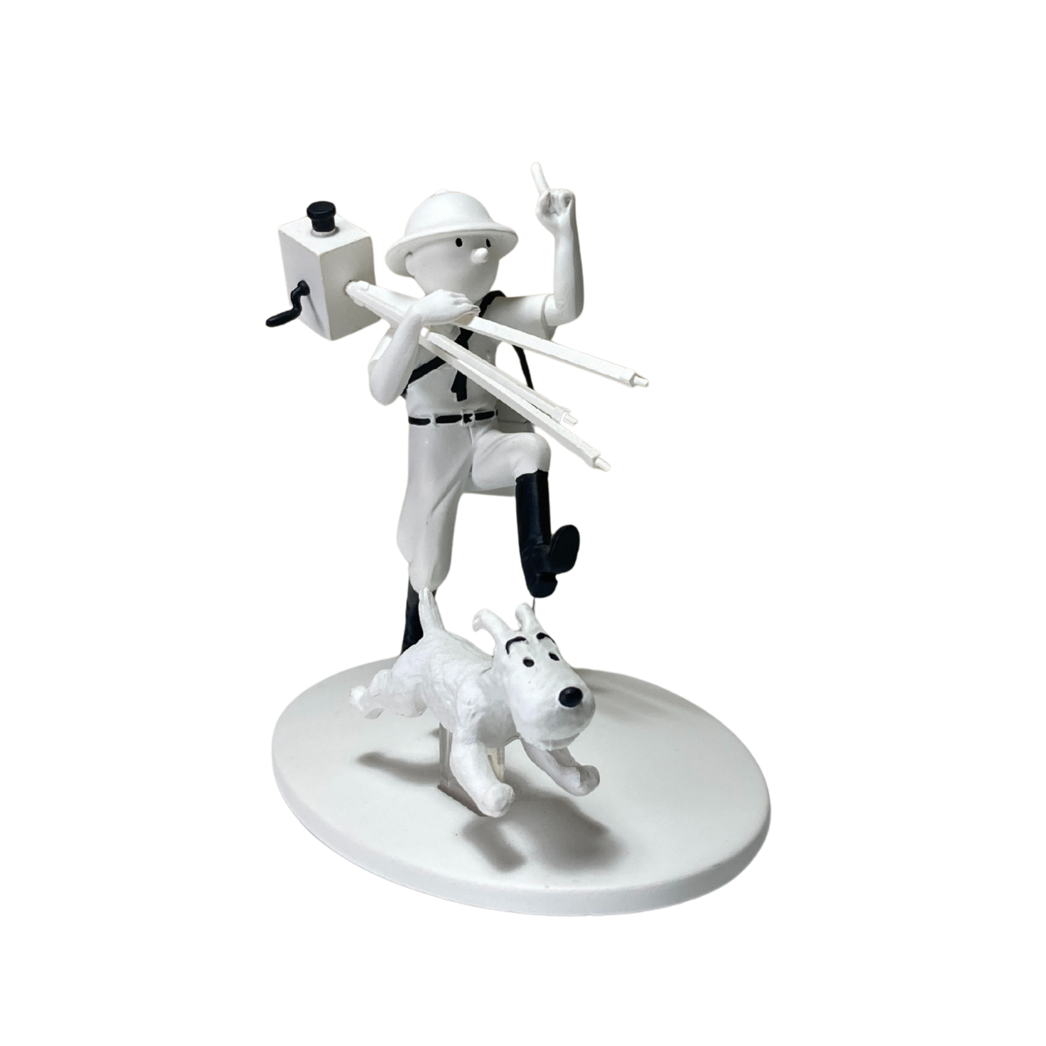Figurine Tintin cinéaste avec Milou au Congo, personnage d'aventure, en détail dans une scène colorée.