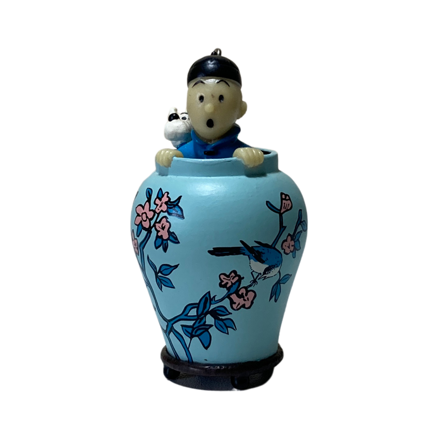 Porte-clé Tintin et Milou dans une potiche, illustré par Hergé, en métal avec détail coloré, pour collection ou décoration.