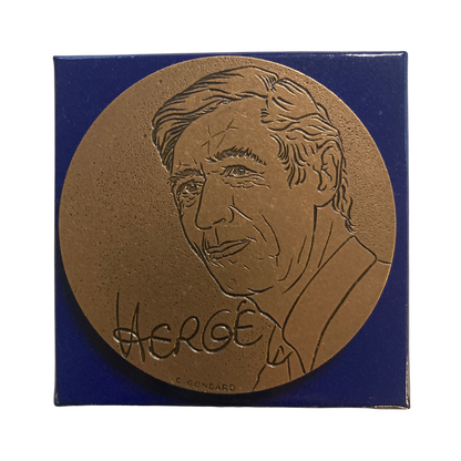 Pièce de monnaie Tintin Hergé Monnaie de Paris, illustrant les aventures de Tintin en relief, avec détails artistiques.