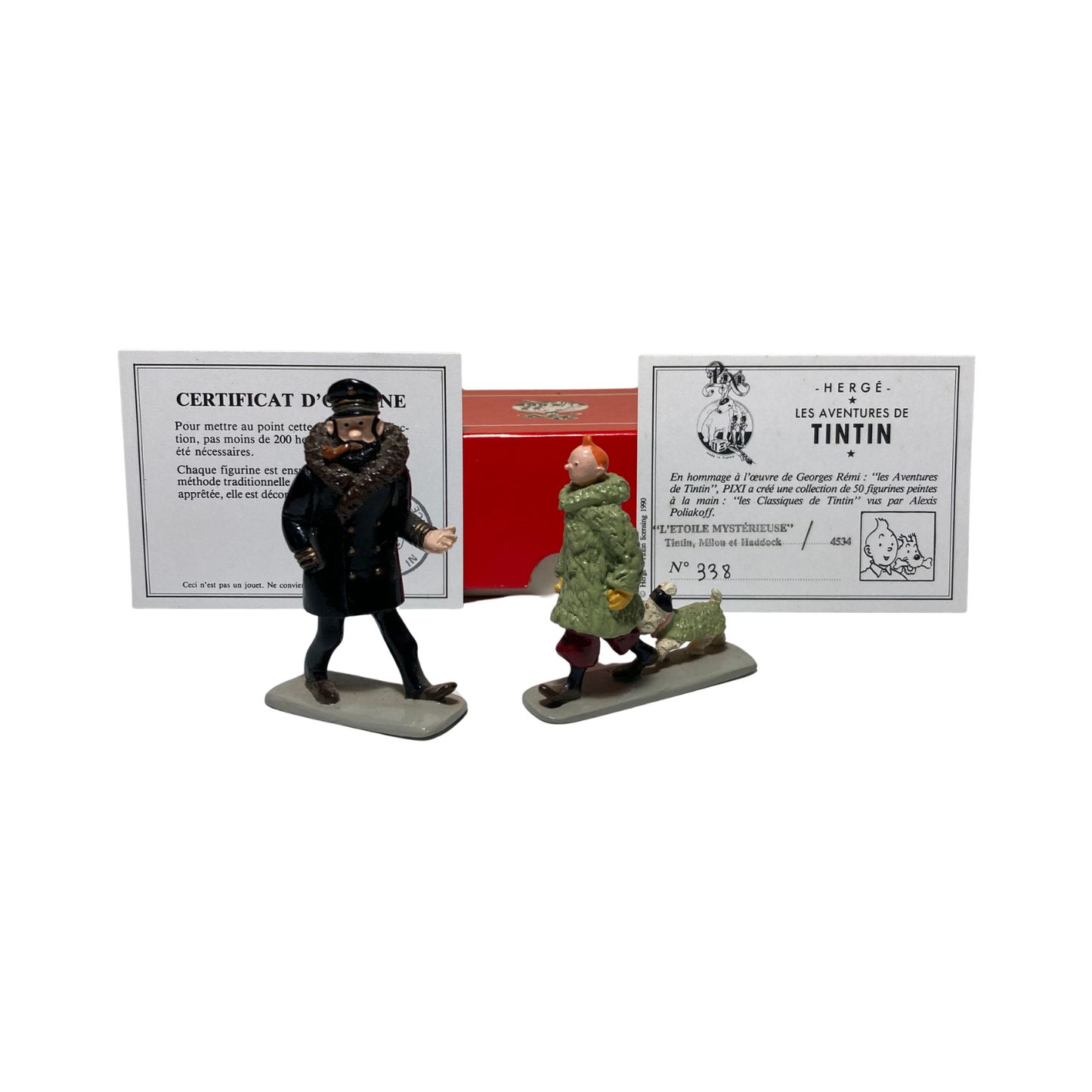 Figurines Tintin, Milou et Haddock en résine de la marque Espace714, représentant les personnages emblématiques de la bande dessinée.
