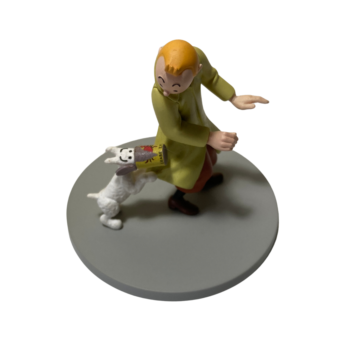 Illustration de Tintin, Milou et la boîte de crabe, illustration colorée d'une scène de bande dessinée.
