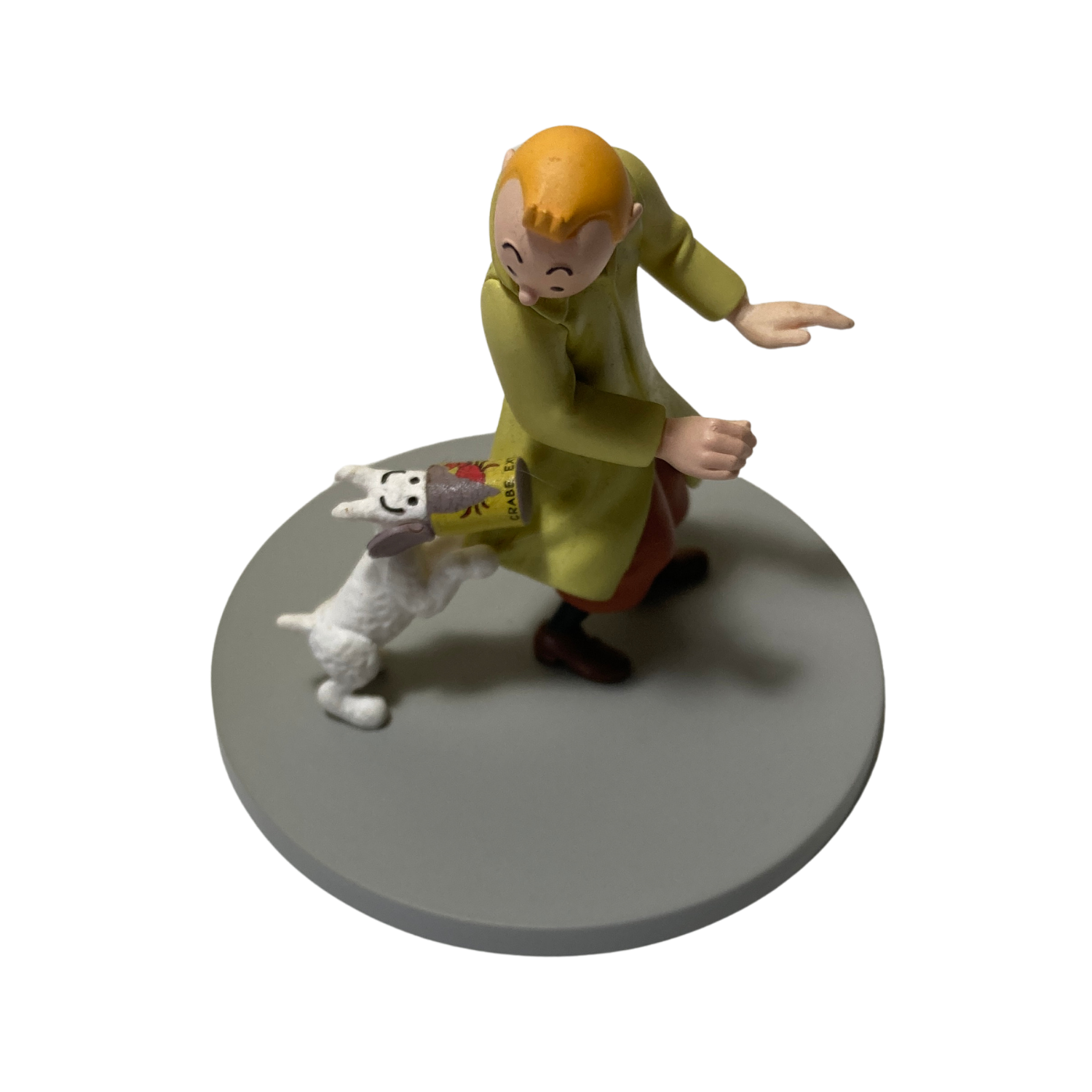 Illustration de Tintin, Milou et la boîte de crabe, illustration colorée d'une scène de bande dessinée.