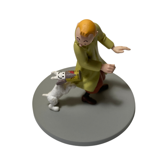 Illustration de Tintin, Milou et la boîte de crabe, illustration colorée d'une scène de bande dessinée.