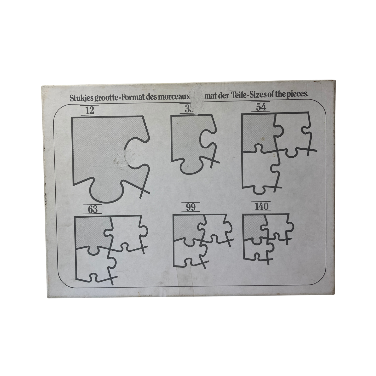 Puzzle Tintin Le secret de la Licorne par Espace714, image du puzzle montrant Tintin et le trésor sur la boîte.