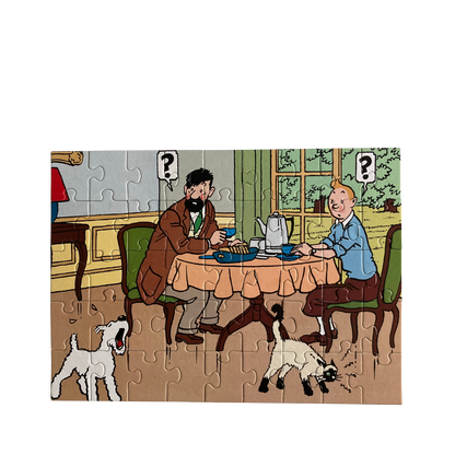 Puzzle Tintin Petit déjeuner à Moulinsart, image colorée montrant Tintin et ses amis autour d'un petit déjeuner.