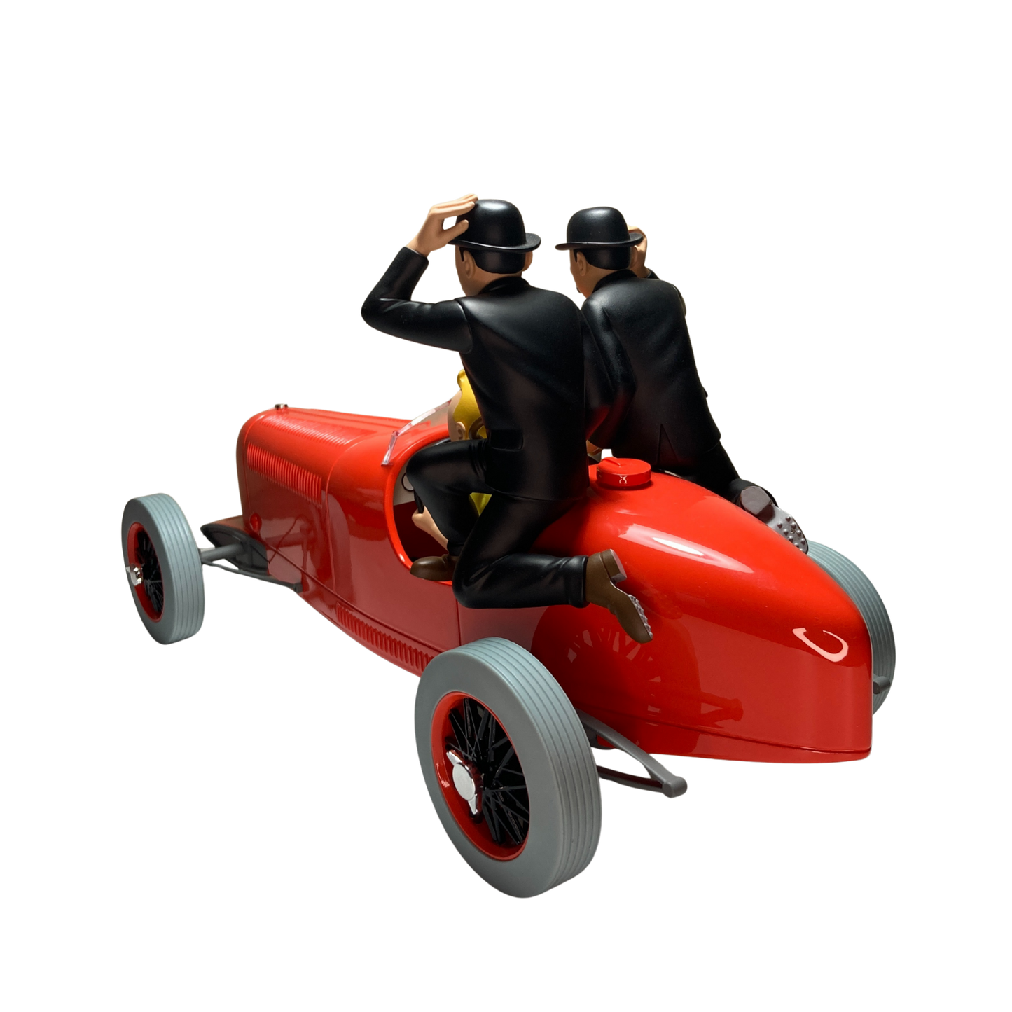 Image de Tintin, les Dupondt et le bolide rouge, figurines de la série BD, avec Tintin en tenue classique et voitures rouges.