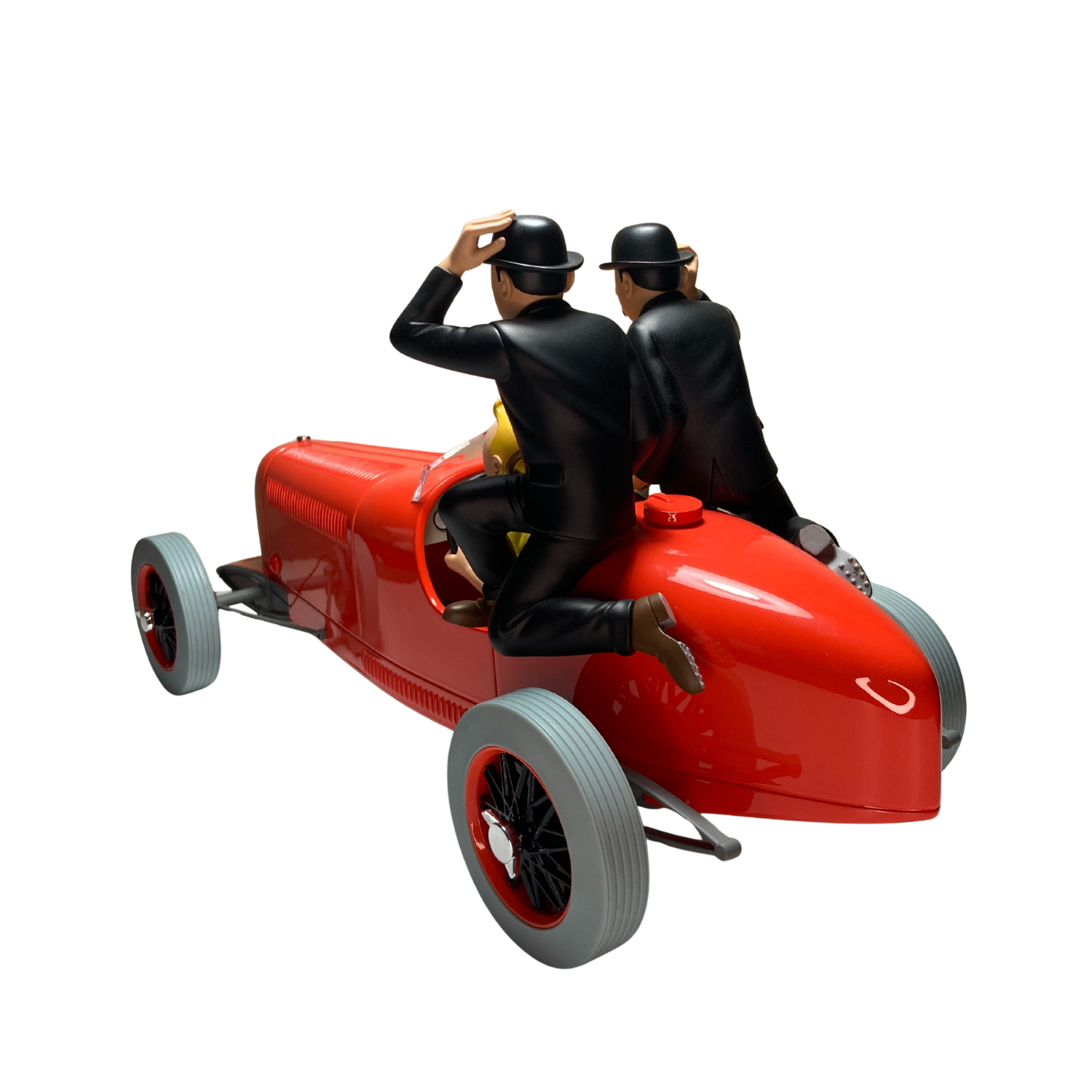Image de Tintin, les Dupondt et le bolide rouge, figurines de la série BD, avec Tintin en tenue classique et voitures rouges.
