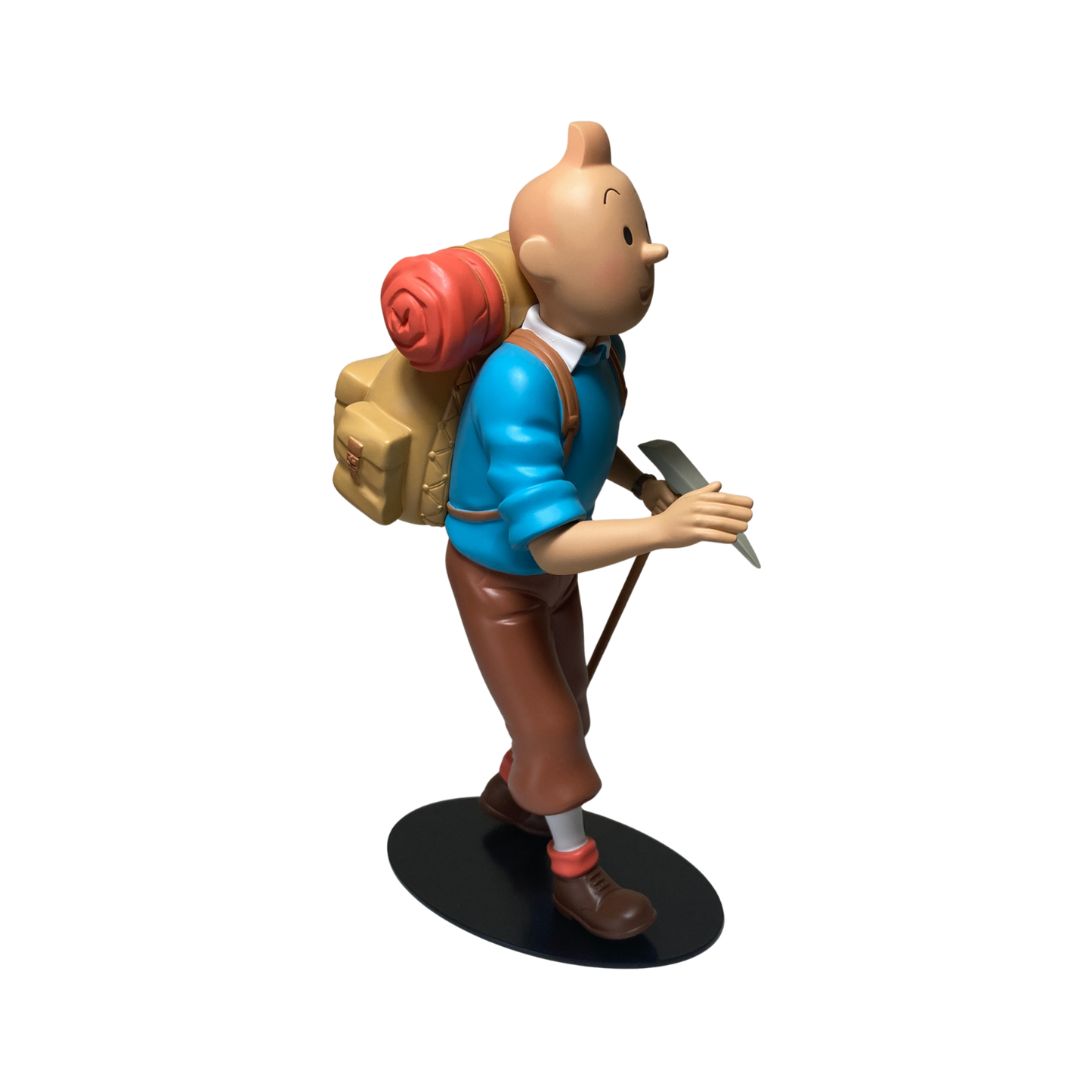 Figure de Tintin alpiniste en costume d'escalade, avec casque et équipement, illustrant le personnage de Tintin chez Espace714