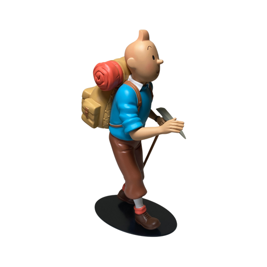Figure de Tintin alpiniste en costume d'escalade, avec casque et équipement, illustrant le personnage de Tintin chez Espace714