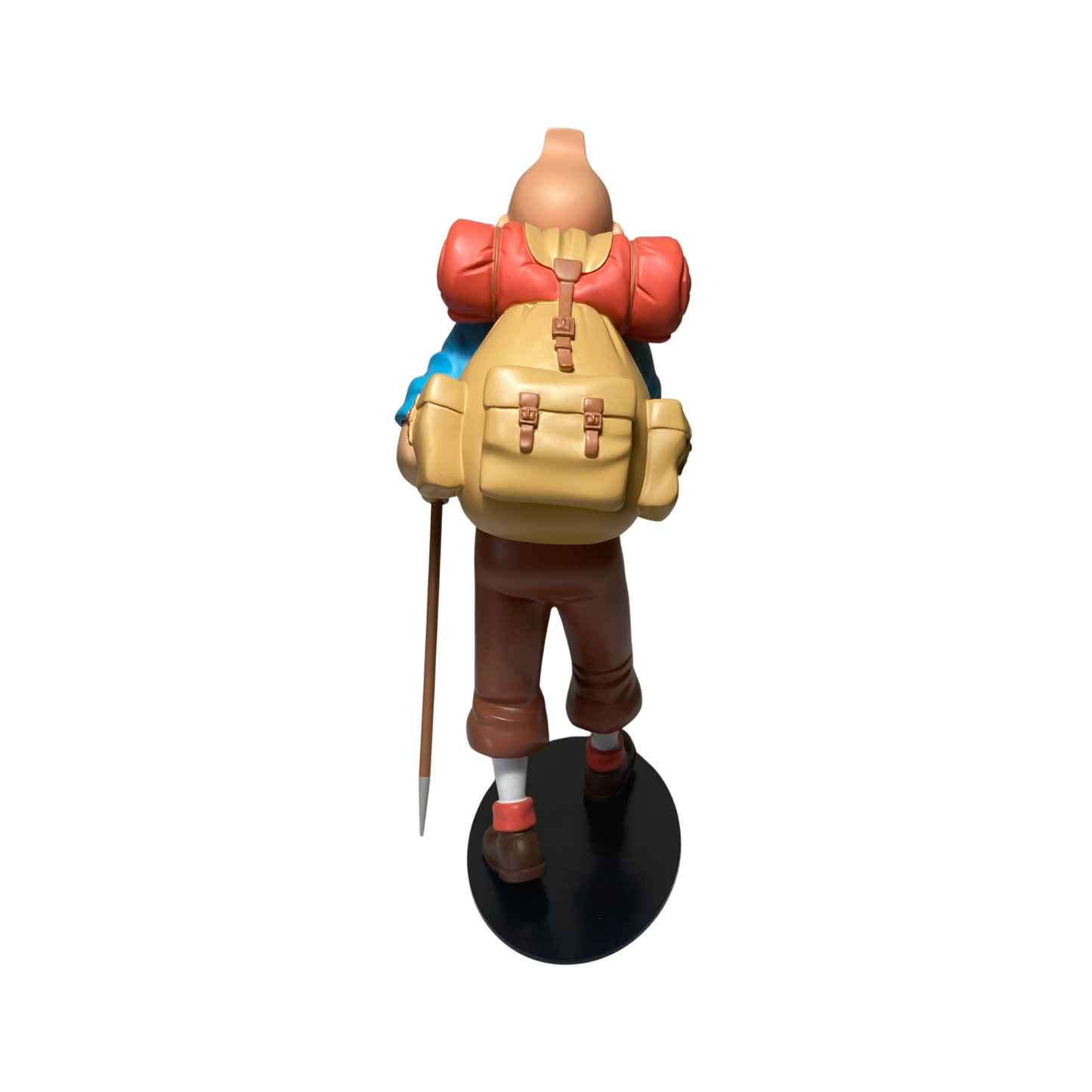 Figure de Tintin alpiniste en figurine détaillée, représentant l'aventurier dans une pose d'escalade.