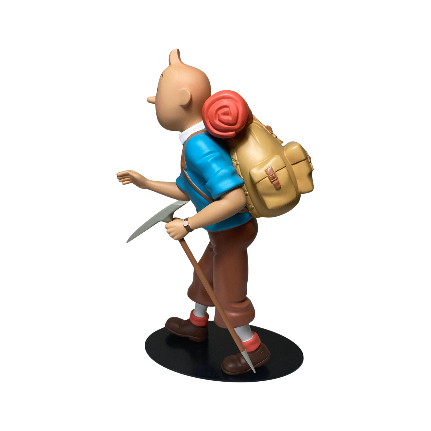 Figurine Tintin alpiniste de la marque Espace714, montrant Tintin en tenue d'alpiniste avec équipement complet.