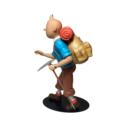 Figurine Tintin alpiniste de la marque Espace714, montrant Tintin en tenue d'alpiniste avec équipement complet.