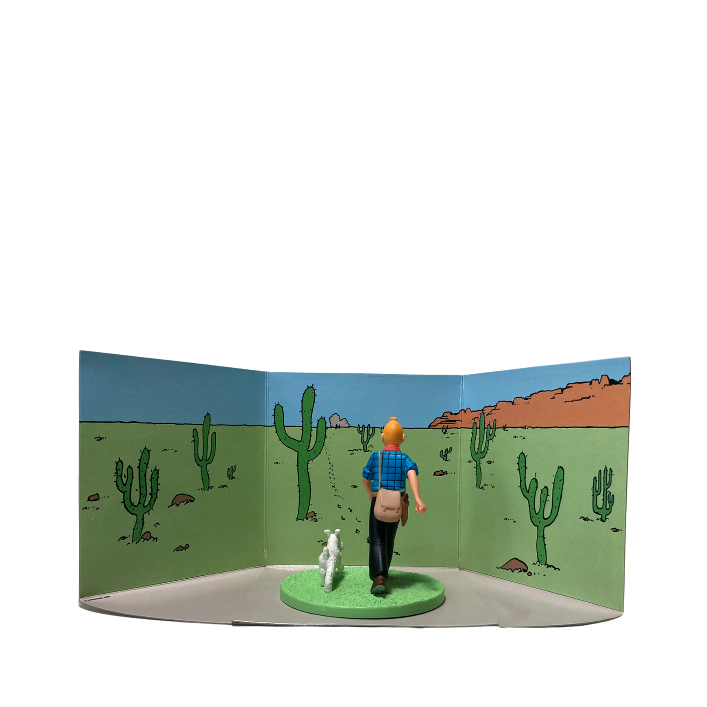 Figure de Tintin en cowboy avec Milou, figurine de collection de Espace714, en pose dynamique et détaillée.