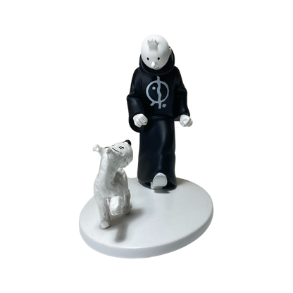 Image de Tintin en toge avec Milou en Inde, illustration colorée et détaillée de la bande dessinée.
