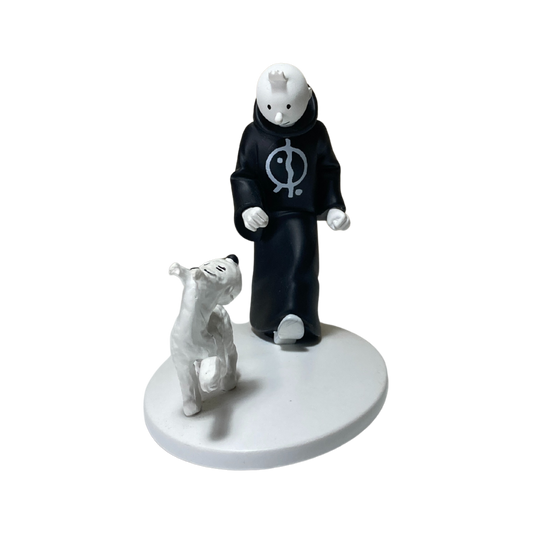 Image de Tintin en toge avec Milou en Inde, illustration colorée et détaillée de la bande dessinée.
