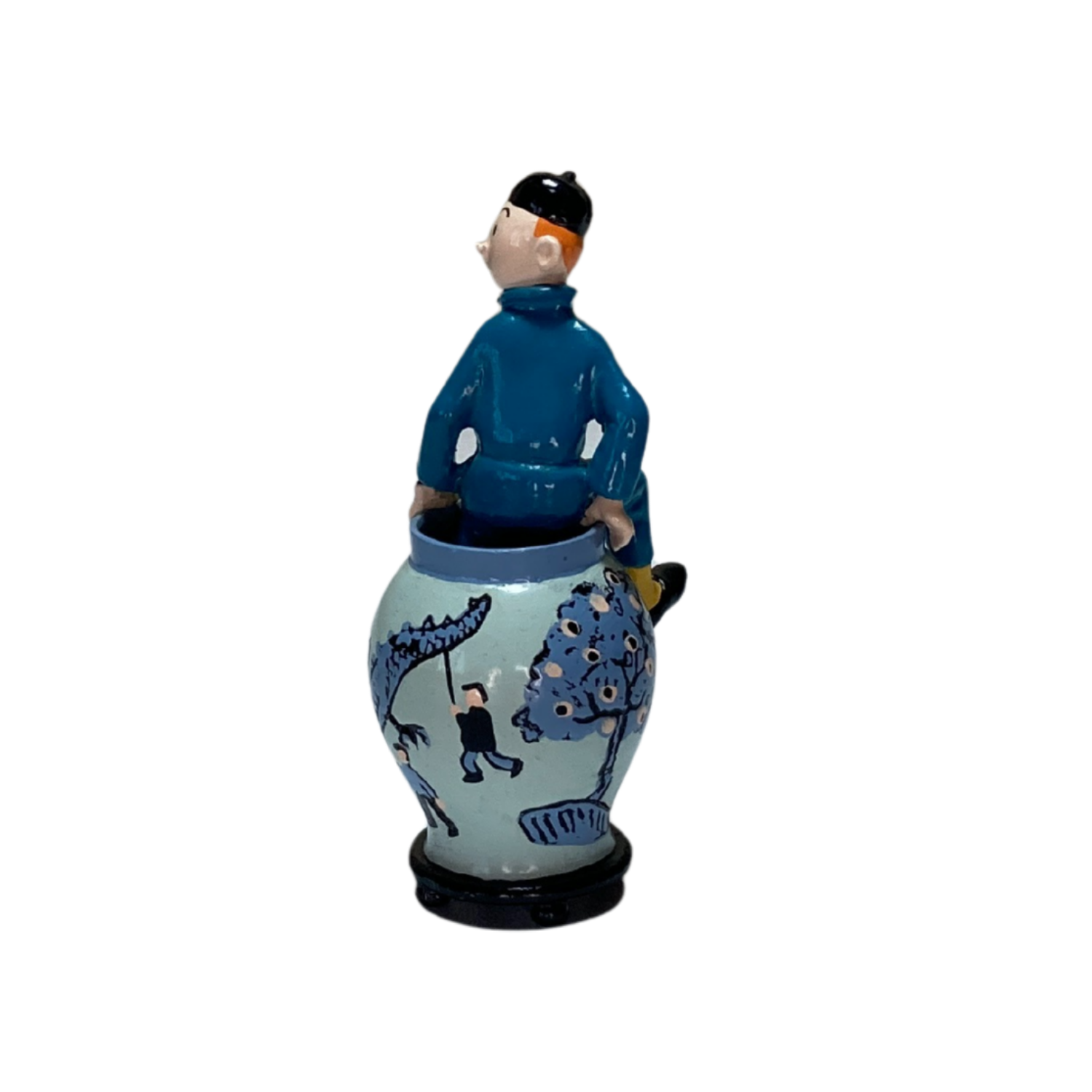 Statue de Tintin sortant d'une potiche en céramique, modèle de la marque Espace714, détail coloré et sculpté.