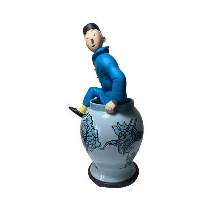 Statue de Tintin sortant d'une potiche en résine de la marque Espace714, détail coloré et figurine de collection.