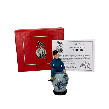 Tintin sortant de la potiche en céramique, décoration originale de la marque Espace714, visible en détail dans l'image.