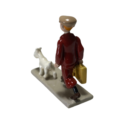 Valise Tintin Espace714 avec illustration de Tintin sur la surface, poignée et roulettes visibles sur l'image.