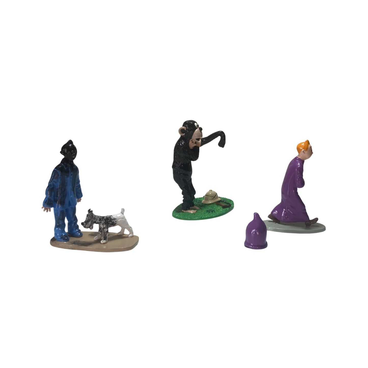 Trio Tintin par Espace714, ensemble de trois figurines ou objets inspirés de Tintin, en couleurs vives et détails précis