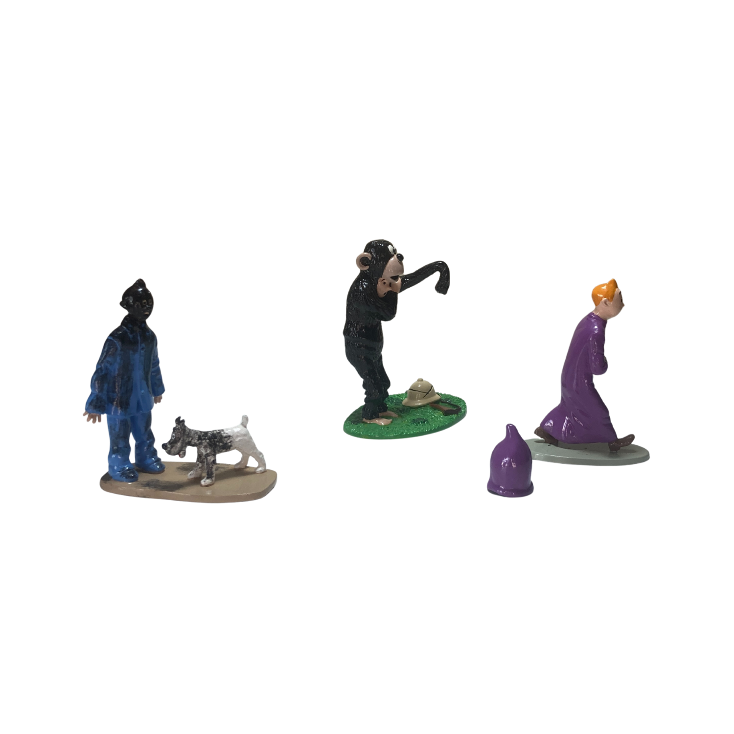 Trio Tintin par Espace714, ensemble de trois figurines ou objets inspirés de Tintin, en couleurs vives et détails précis
