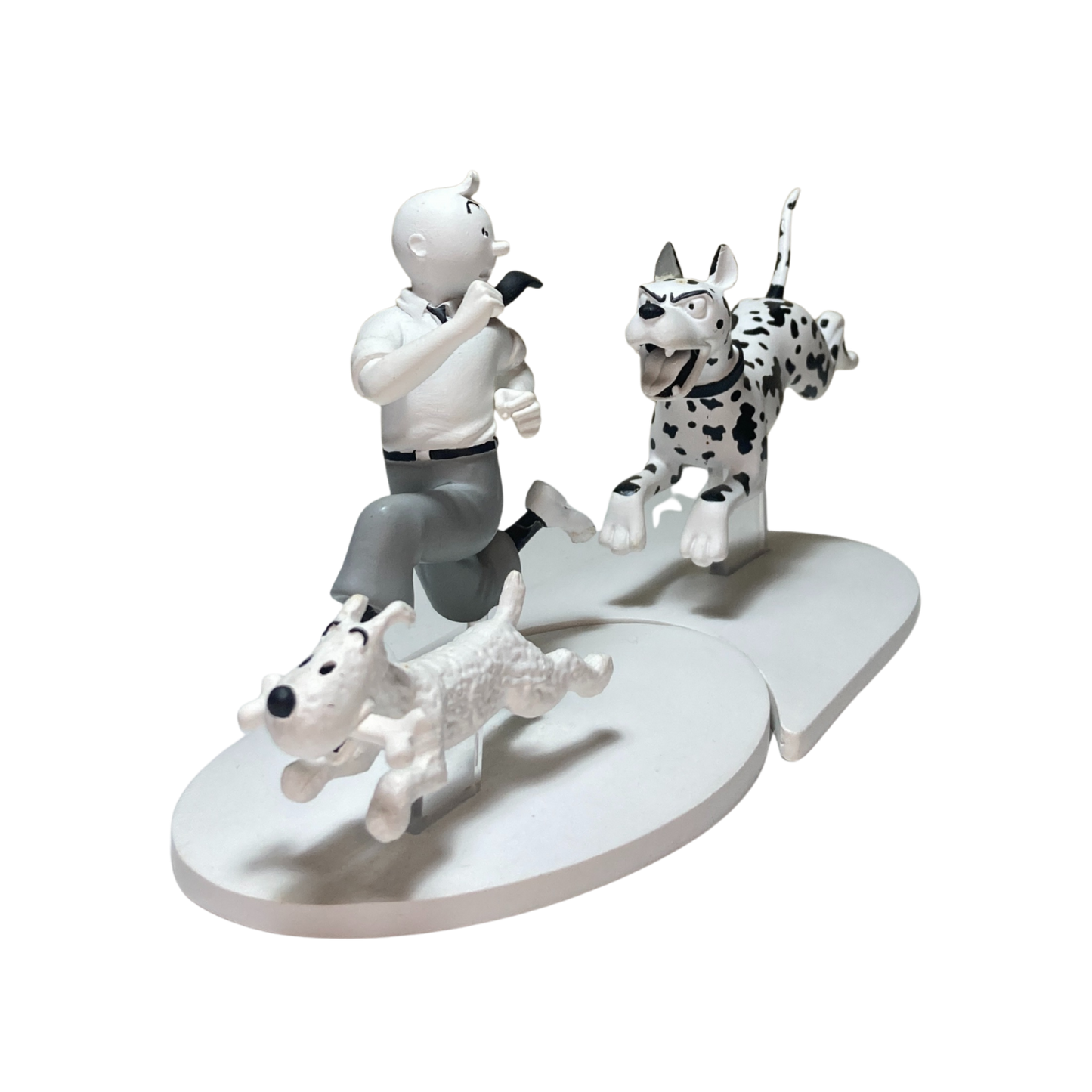 Page Tintin en fuite et Milou en Angleterre, figurines de collection Espace714, illustrant Tintin et Milou en voyage en Angleterre.